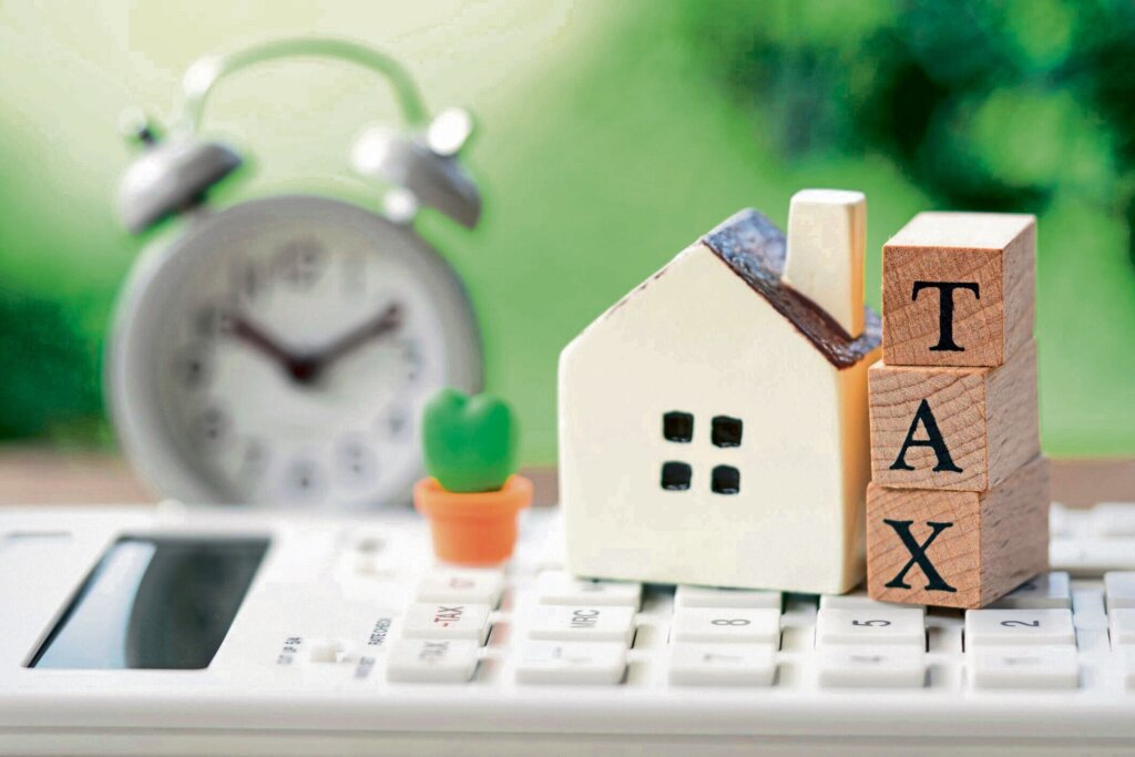 Homeowner reviewing tax documents and house sale paperwork in Texas
