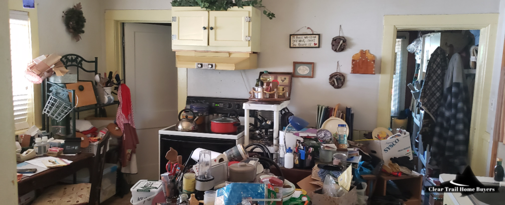 cluttered kitchen of house bought fast for cash in Wausau, WI