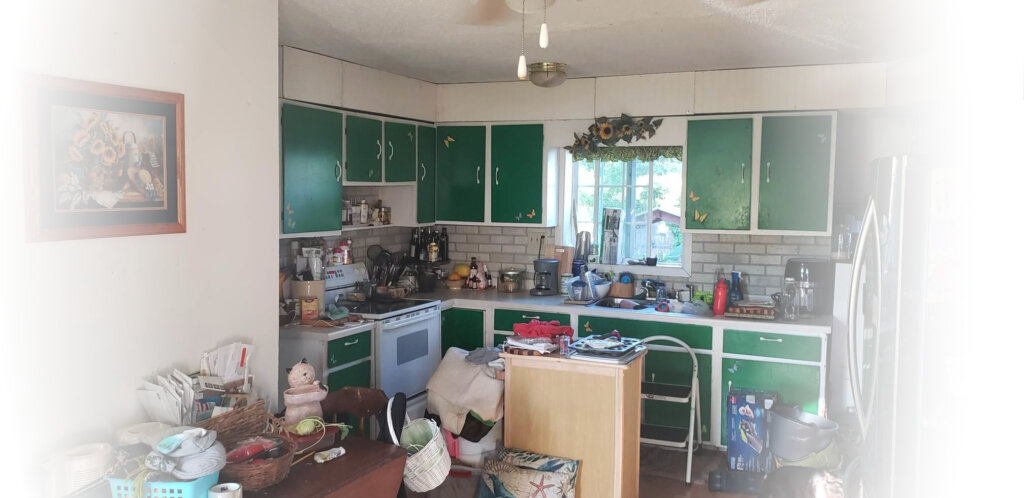 messy and cluttered kitchen from home we bought fast in wausau wisconsin for cash.
