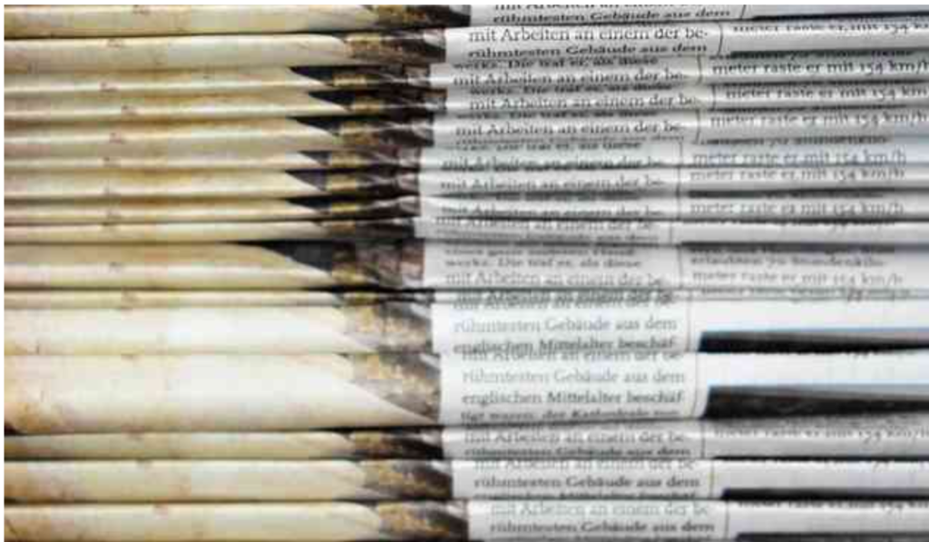 Picture of a stack of newspapers for Tower Genius Media mentions.