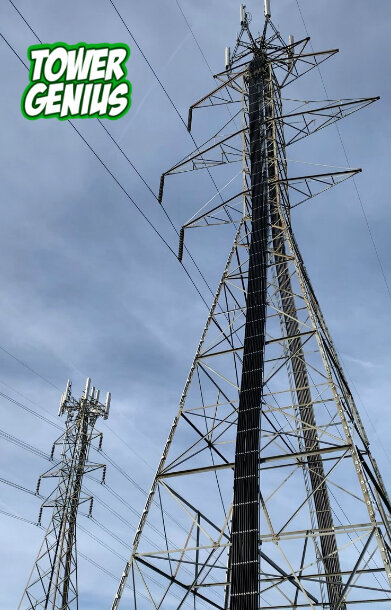 Two electrical lattice transmission towers with cell site antennas and Tower Genius logo