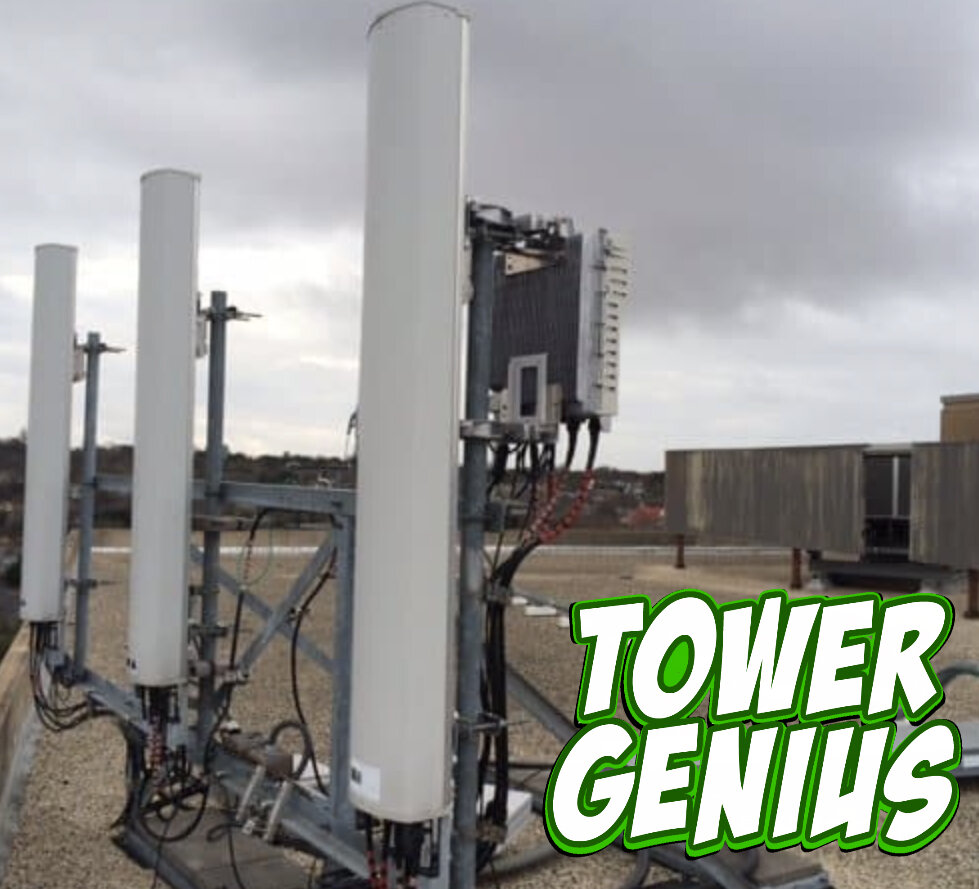 picture of rooftop cell site antenna and sled with Tower Genius logo