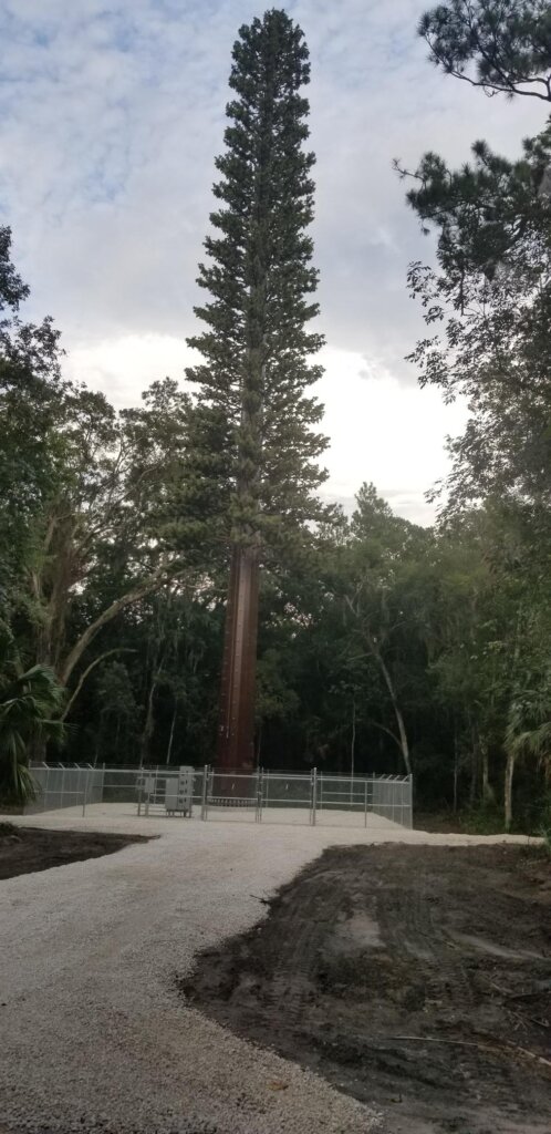 AT&T stealth monotone cell tower monopole cell site in Fernandia beach Florida.
