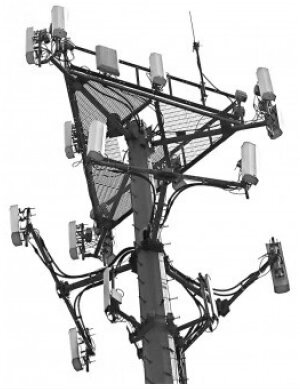 Monopole cell tower black and white image.