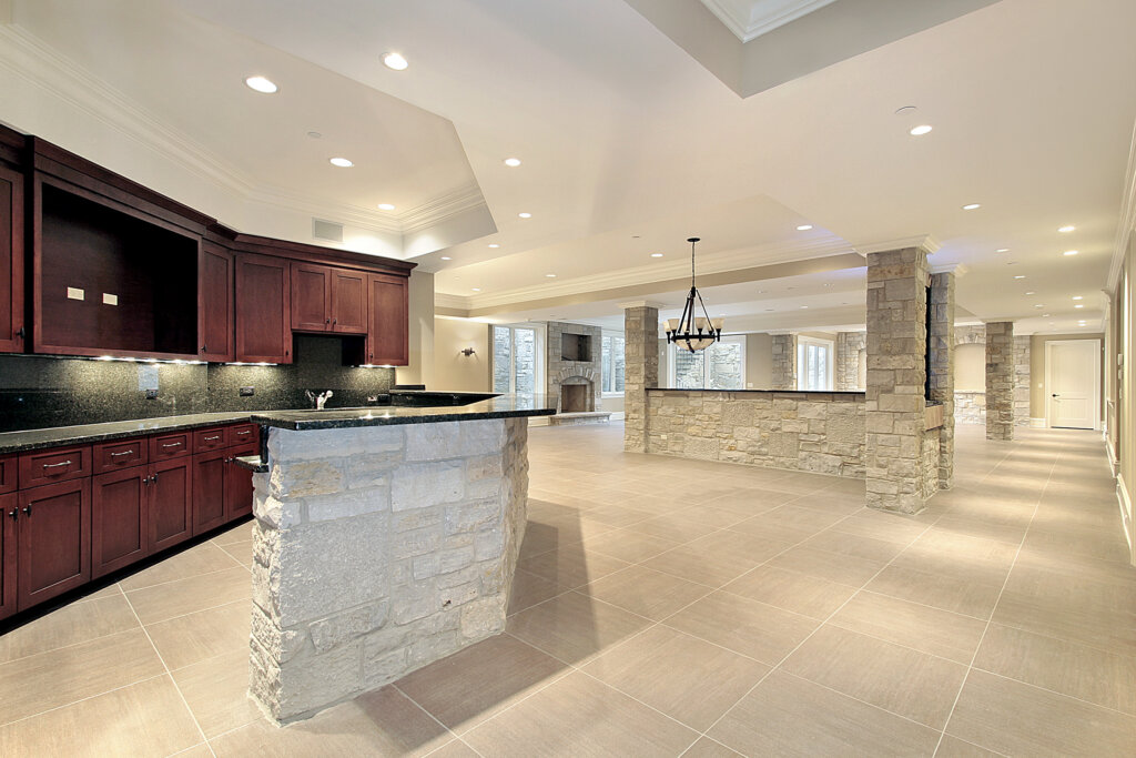 Basement-renovations-Winnipeg-large-room-with-stone-and-a-kitchen-island