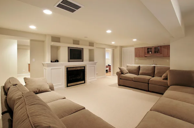 Basement renovations Winnipeg living room with a fireplace and couches