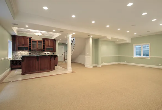 Basement renovations Winnipeg room with a bar and a staircase