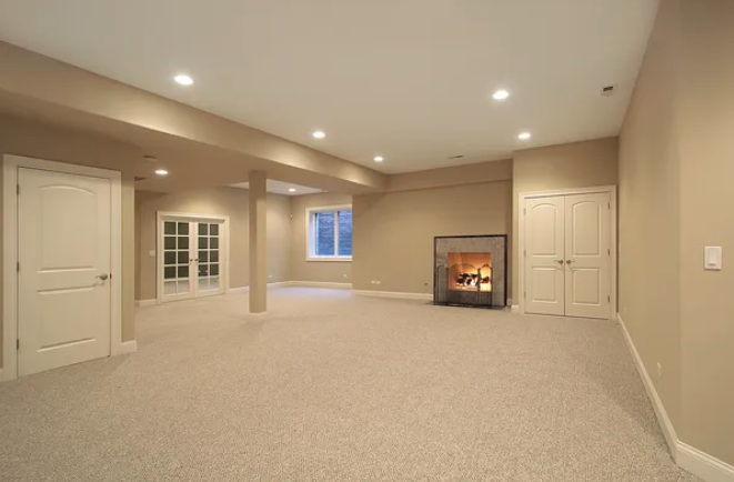 Basement renovations Winnipeg room with a fireplace and doors