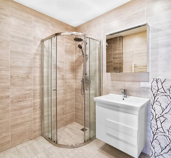 brownish bathroom renovations with a shower sink
with mirrors