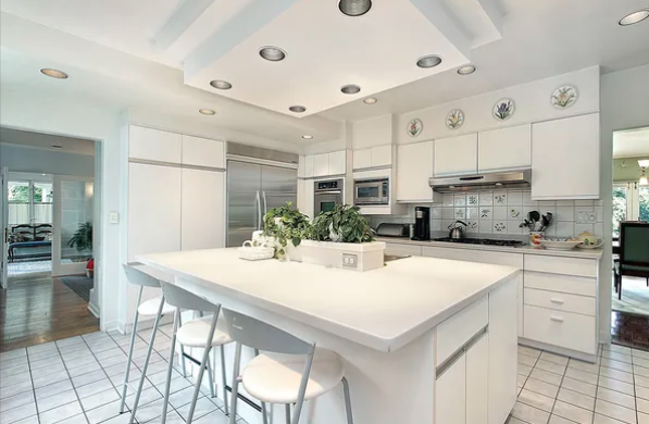 a-white-kitchen-with-a-white-island-and-white-cabinets