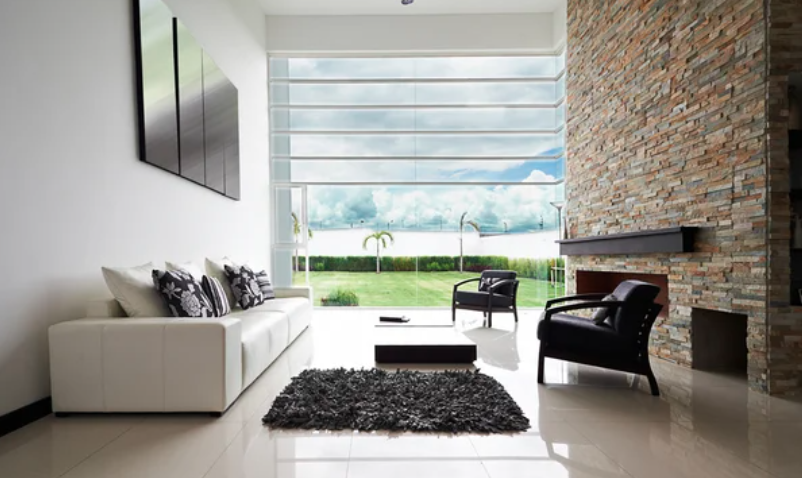 Home renovations Winnipeg living room with a fireplace and leather couches