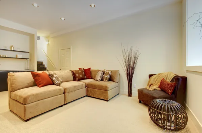 Living room with a couch and a brown chair