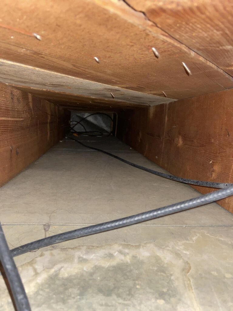 cleaned a hole in a wood wall air duct cleaning calgary