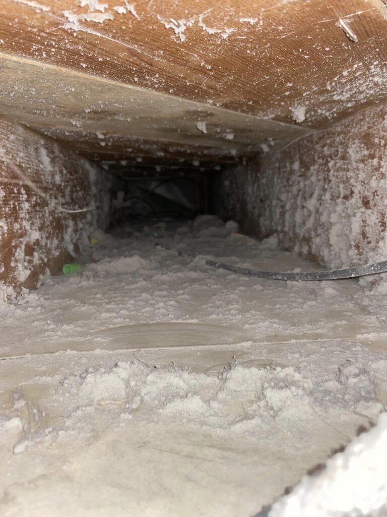a hole in a wood wall air duct cleaning calgary