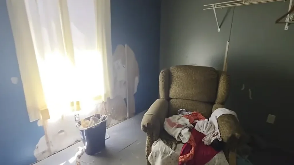 Interior of a tenant-occupied Pensacola rental after the eviction, before renovation