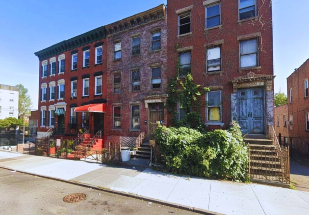 Row of brownstones in Concourse Bronx showing varied conditions from maintained to distressed — 718Homebuyers buys houses as-is for cash