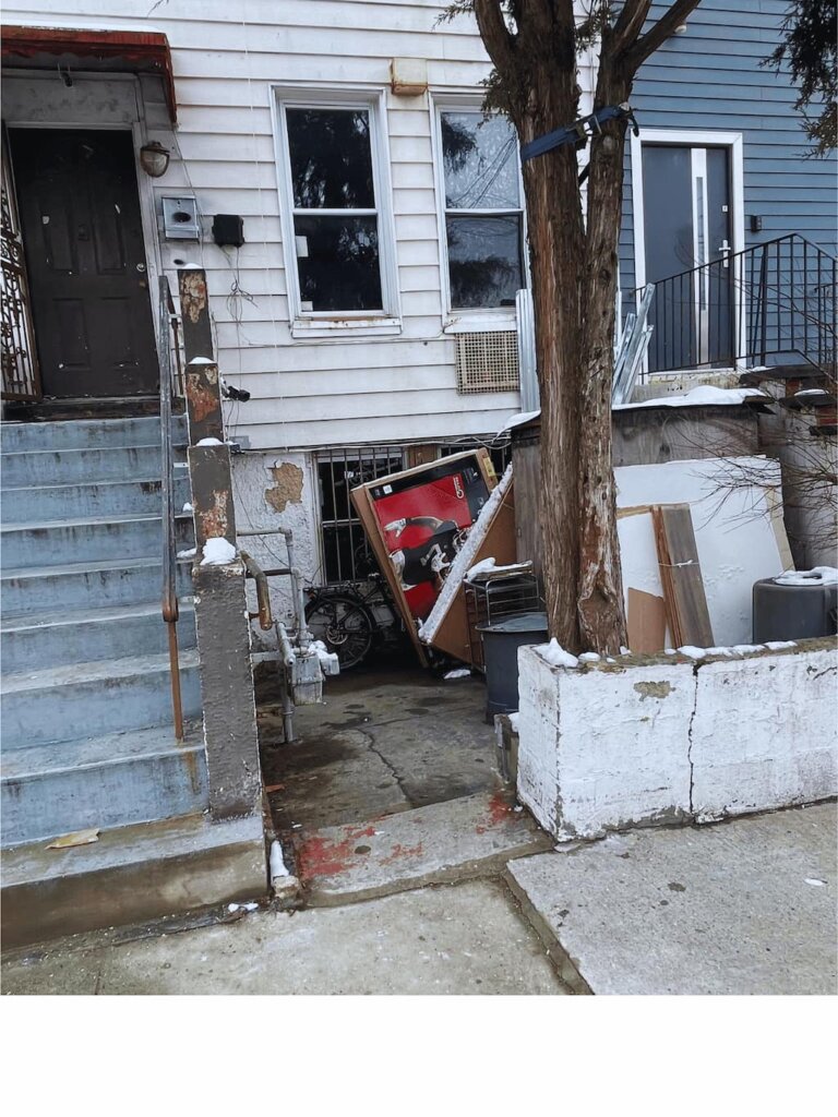 Distressed multi-family property in Mott Haven Bronx with foundation damage and deferred maintenance — 718Homebuyers buys houses as-is for cash