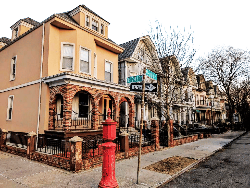 We buy Woodlawn homes As-Is — including brick row houses near Martha Ave and E 241st St. and beyond