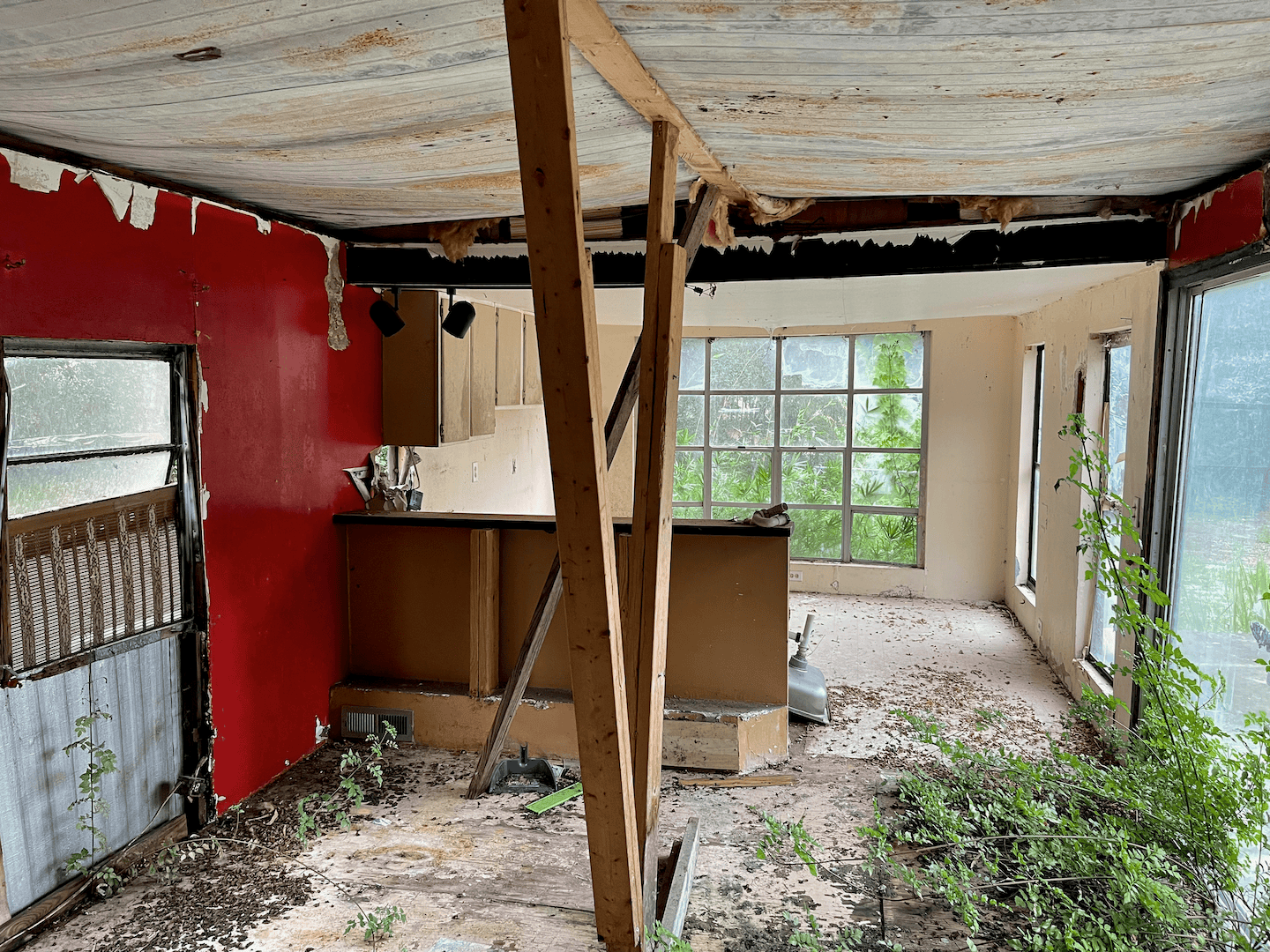 An old mobile home sitting on a lot, ready for demolition