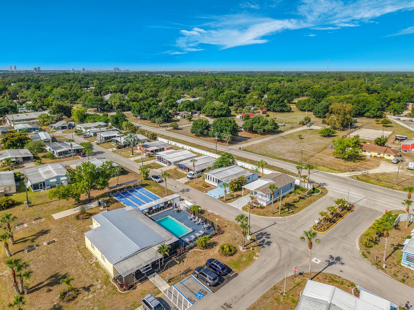 Aerial view of a mobile home community in North Fort Myers, Florida, with paved streets and mature landscaping