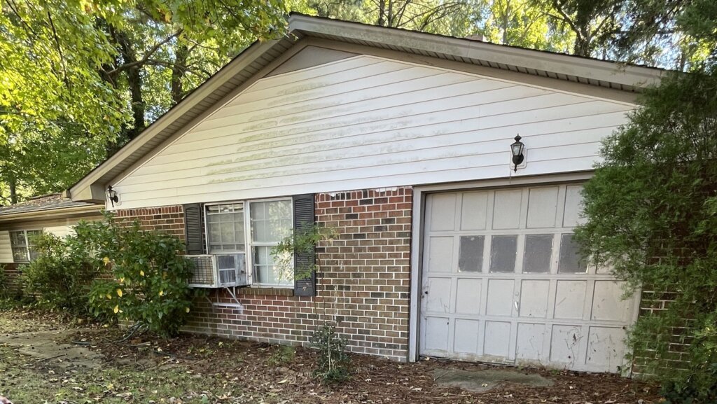 A house with an unmaintained garden