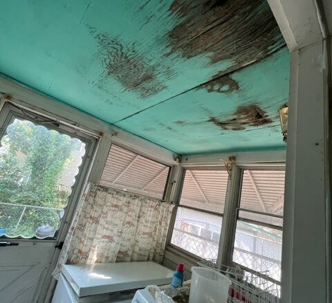 An image of a damage roof of a house for sale on cash