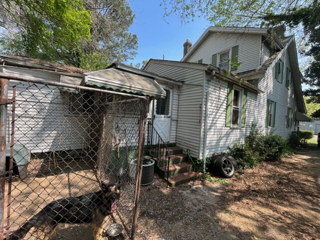 An exterior image of a damaged house.