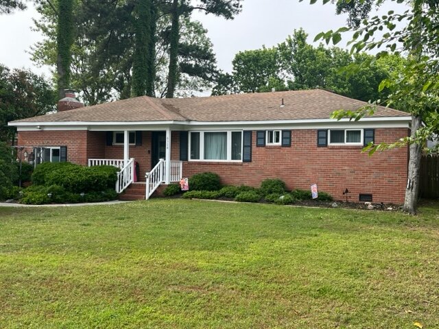 A house with a mowed loan increasing the curb appeal of an house