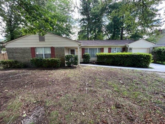An exterior image of a house in Virginia Beach with a garden, bought by HR Property Doctor On Cash- Top Cash Home Buyers In Virginia Beach