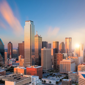 Dallas skyline at sunset under a clear Texas sky