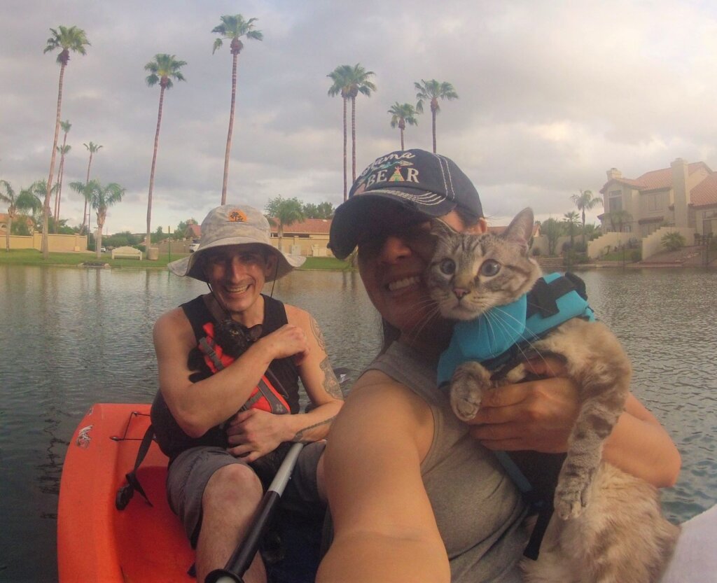Rhonda Folsom and Lance Farr kayaking with two of their cats, Maui and Journey.