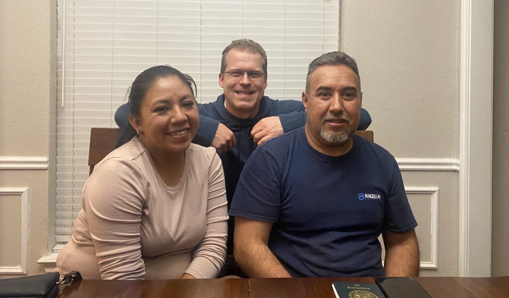 A happy Spanish speaking couple when given the support and cash offer pictured with Grant