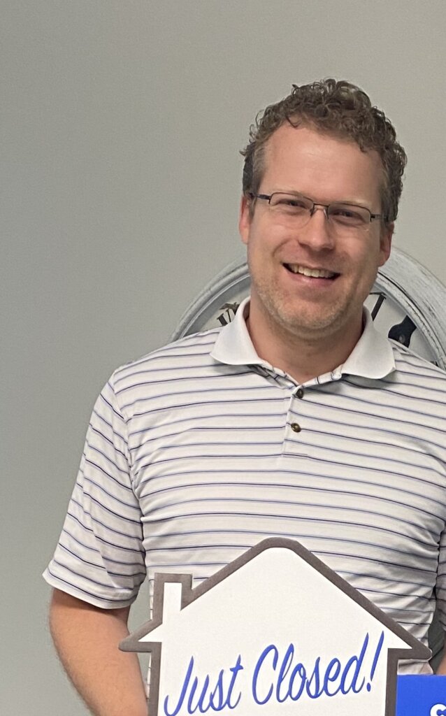 Picture of your trusted home buyer, Grant, who just closed on a property at the title company.