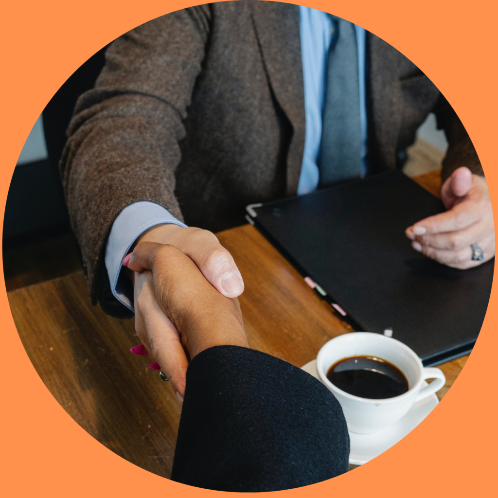 picture of two people shaking hands to illustrate the value of partnership when we home buyers meet sellers