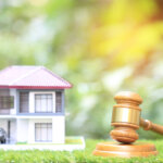 Property auction, Gavel wooden and model house on natural green background, lawyer of home real estate and ownership property concept