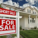 Home buyer reviewing documents before buying a short sale on house