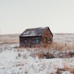 picture of a small run down house with no neighbors or amenities