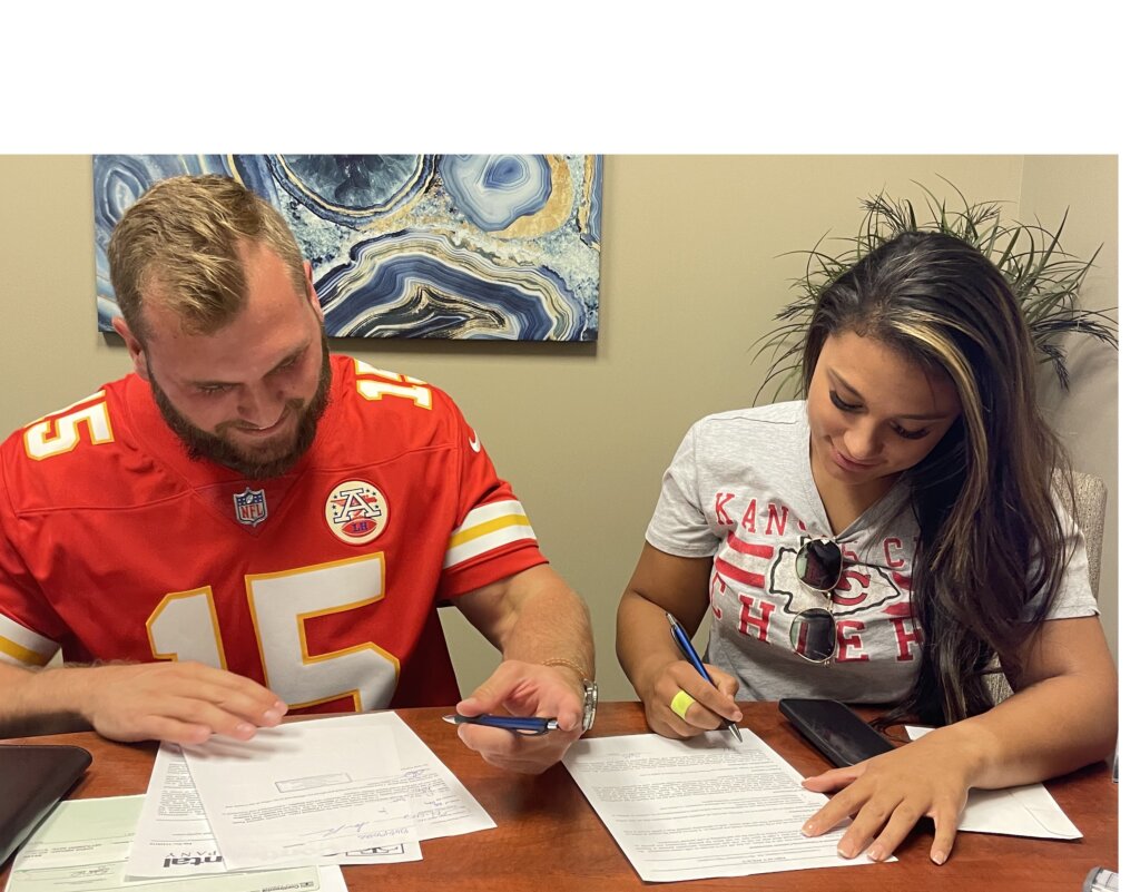 Tahsha and Sam Blacksher of Limitless Homes of KC closing on a property purchase