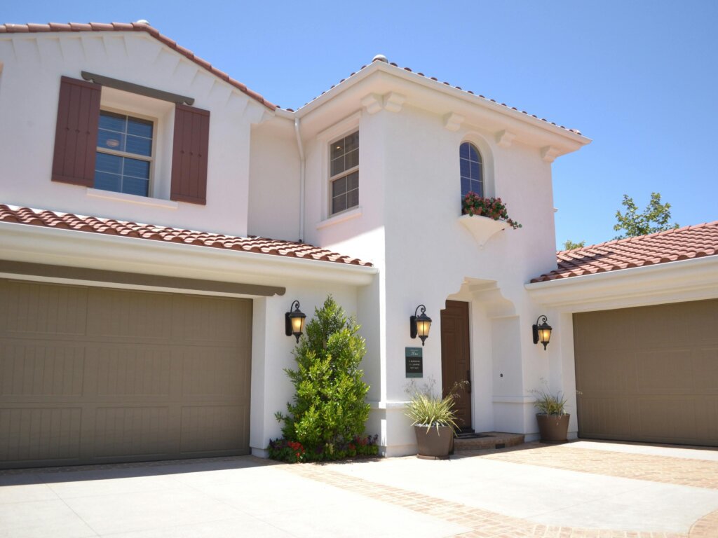 Modern stucco home with attached garage
