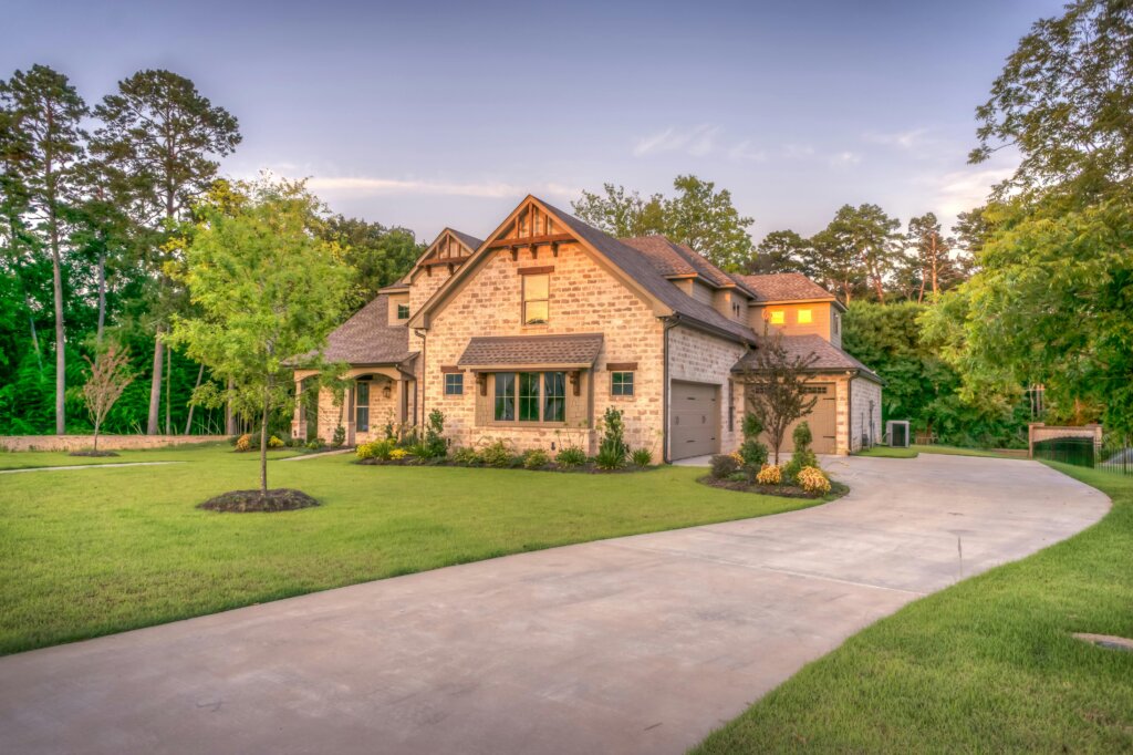 Luxury custom home with landscaped yard