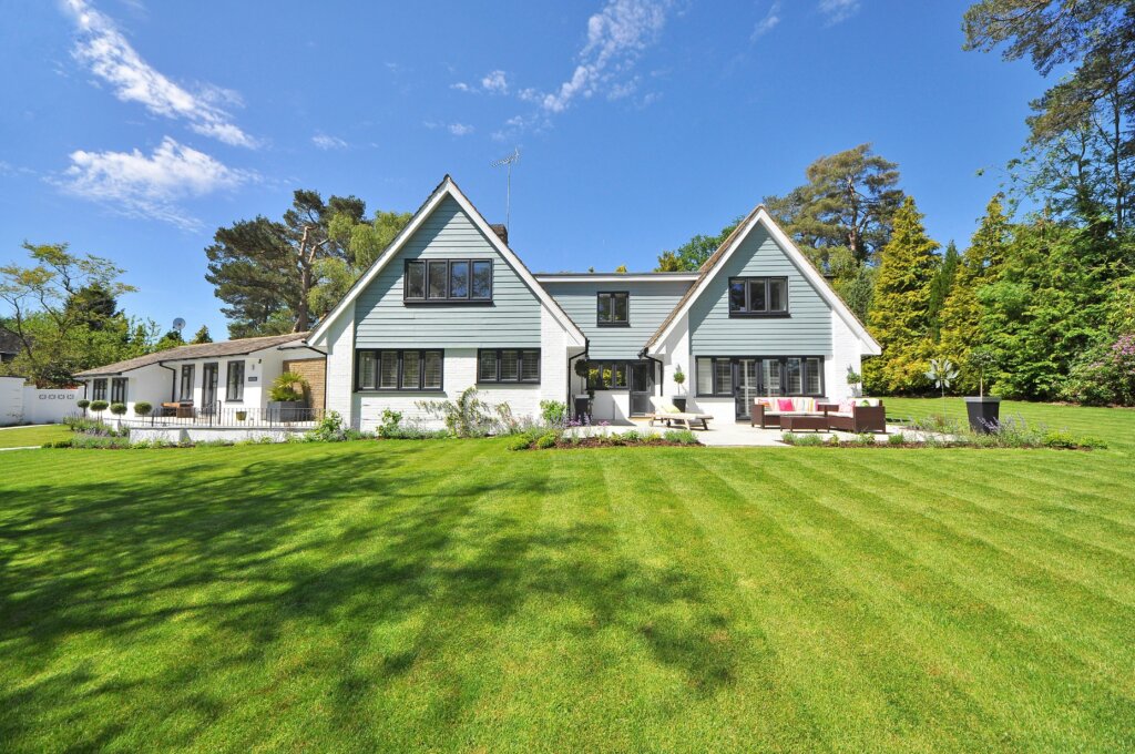 Contemporary farmhouse with manicured lawn