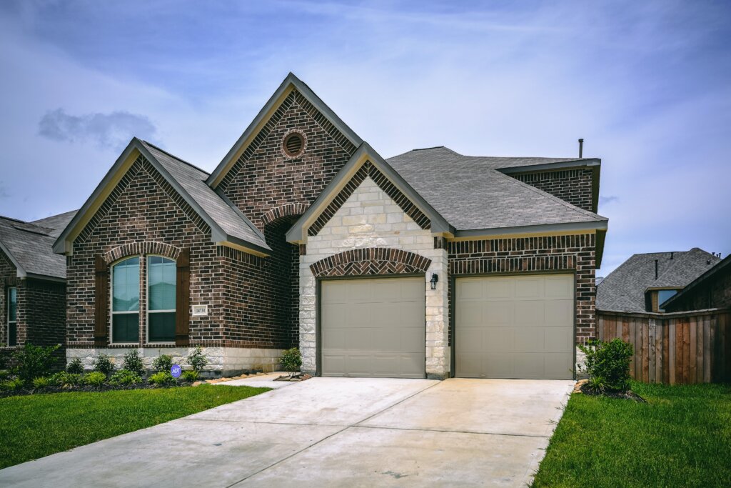 Brick home with double garage driveway