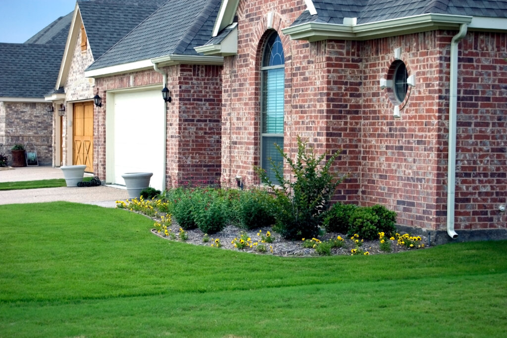 Brick home with landscaped front yard
