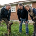 A worried homeowner looking at an old oil tank vent pipe in the backyard of a Hamilton Ontario home