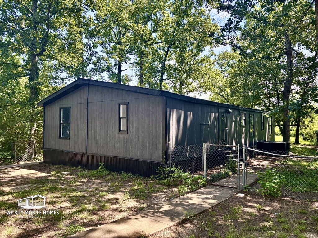 Fully renovated 3 bedroom 2 bathroom mobile home for sale in Rome GA with large private wooded lot