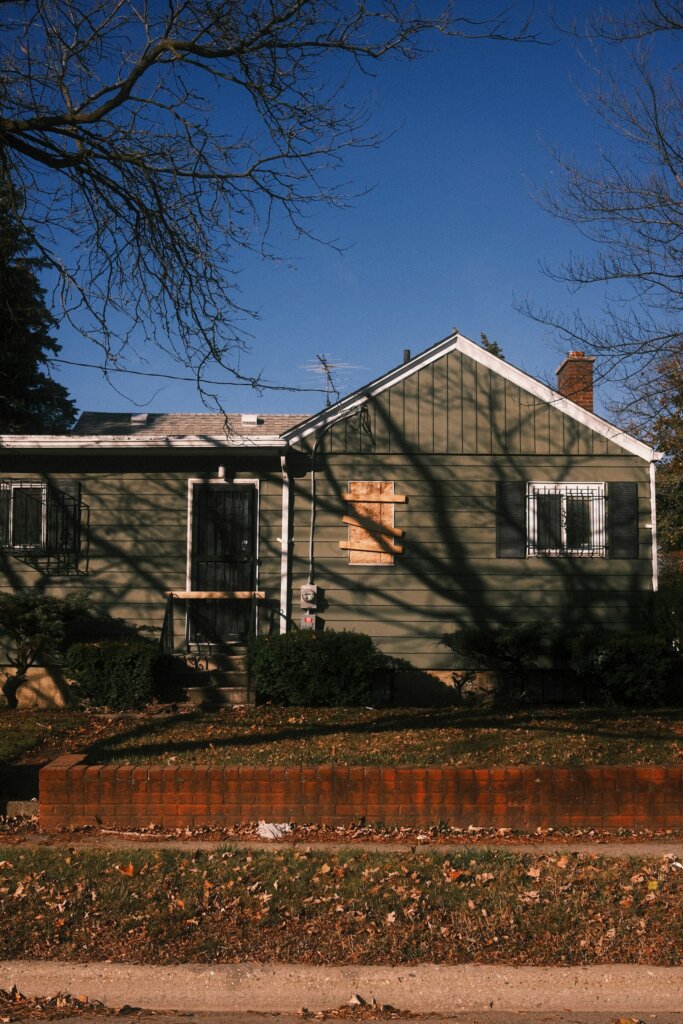 Older wood-sided house on a winter day