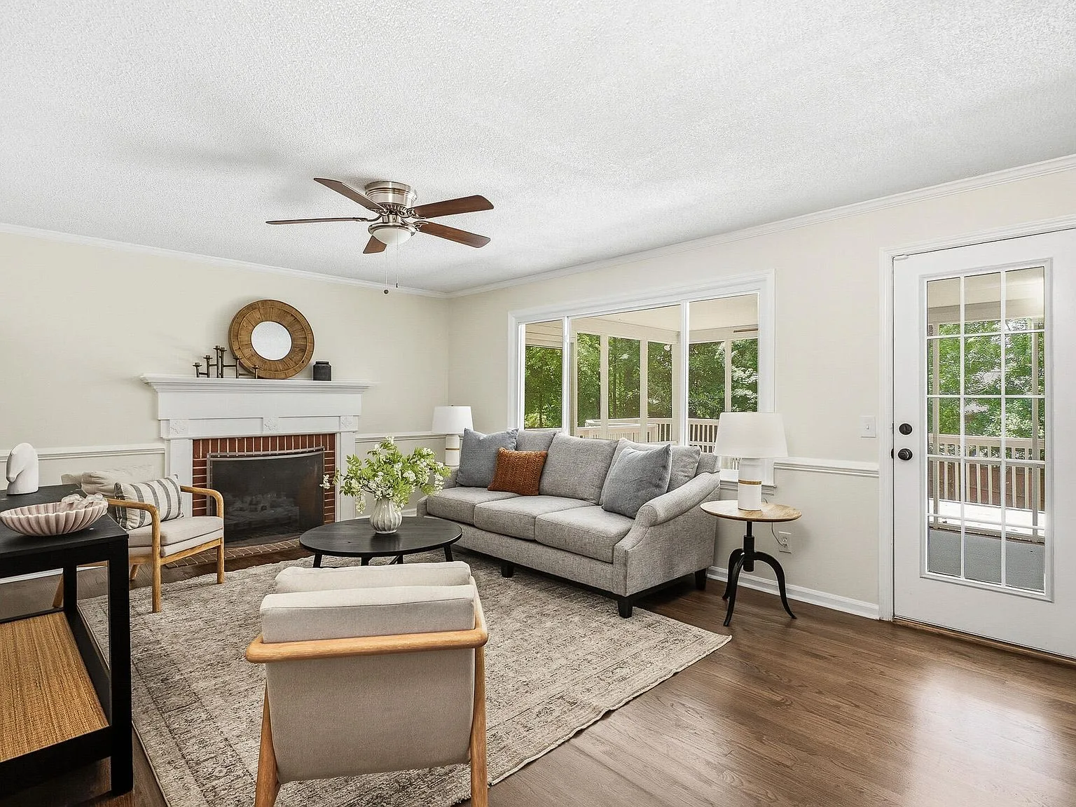 Renovated living room with brick fireplace in an Aiken, SC home