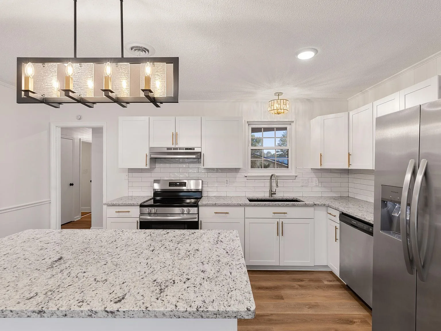 Renovated kitchen with granite island in an Augusta, GA ranch home