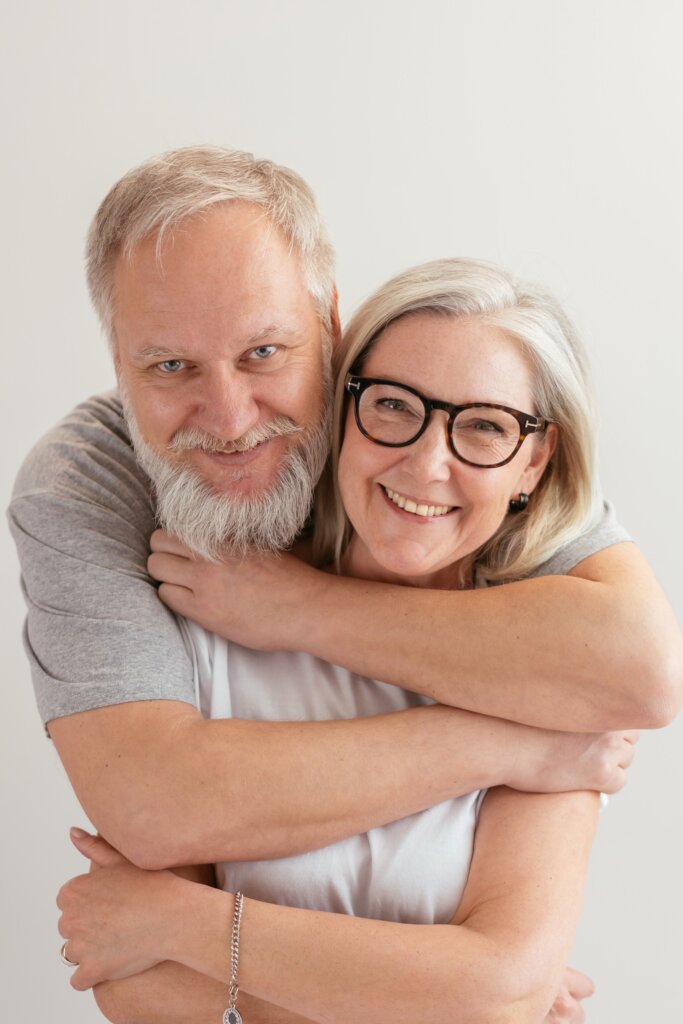 Happy couple that is in love and relieved to have sold a house they had inherited. The house needed a lot of work and they were overwhelmed.