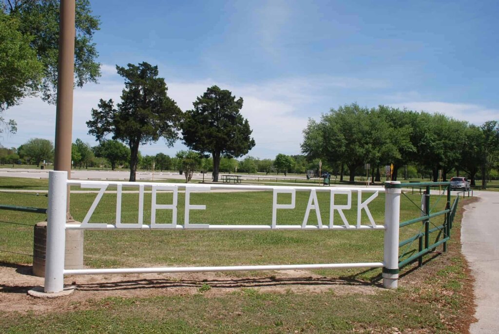 photo of gate entering Zube Park which is a well known park in Hockley, Texas. The park has trails, playgrounds, large lake and fun attractions. J&A Home Buyers enjoy the spacious fun Hockley offers it's residents.